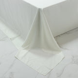 White tablecloth draping elegantly over a table edge.