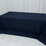 Navy tablecloth draped over a table in a studio setting