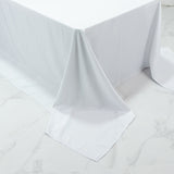 White tablecloth draped elegantly over a table edge