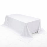 White rectangular tablecloth draped elegantly over a table