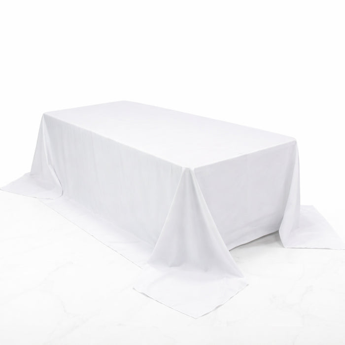White rectangular tablecloth draped elegantly over a table