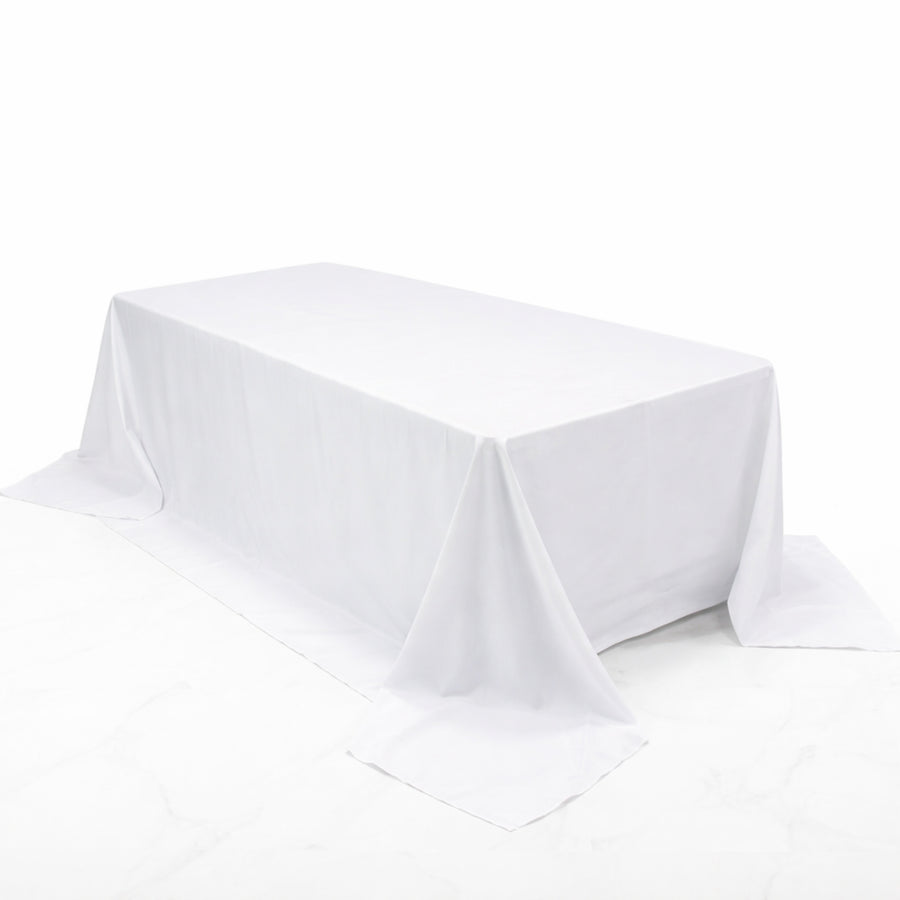 White rectangular tablecloth draped elegantly over a table