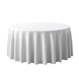 Round white table with elegant draped tablecloth