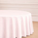 Round pink tablecloth draping elegantly over a table.