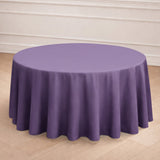 Purple round tablecloth on a wooden floor backdrop.