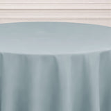Round light blue tablecloth on a plain surface.