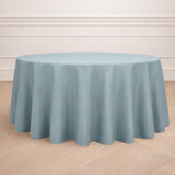 Round tablecloth in soft blue fabric draped elegantly over a circular table.