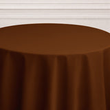 Brown tablecloth draped elegantly over a round table.