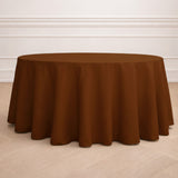 Brown round tablecloth draped over a table in a stylish setting.
