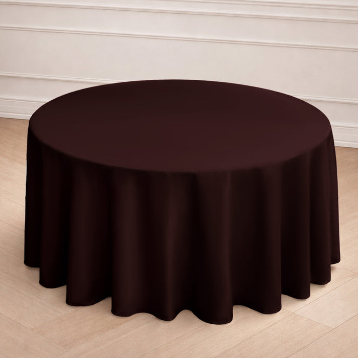 Round burgundy tablecloth draping elegantly over a table.
