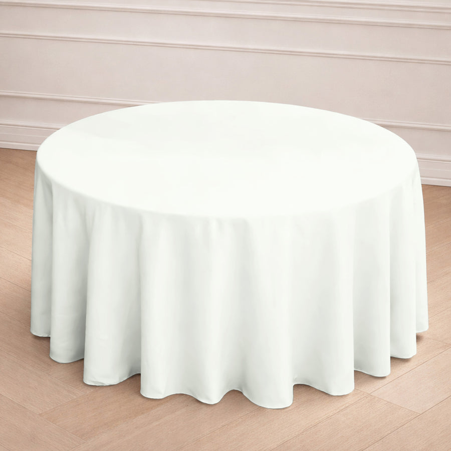 Round white tablecloth draped elegantly on a table.