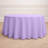 Purple round tablecloth on a wooden floor.