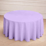 Round purple tablecloth draped over a table in a light indoor setting.