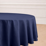 Navy blue round tablecloth elegantly draping over a table.