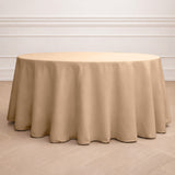 Round beige tablecloth on a round table in a minimalist setting.