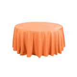 Orange round tablecloth with a flowing design.