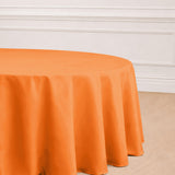 Orange round tablecloth draping elegantly over a table.