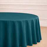 Teal round tablecloth draping elegantly over a table.