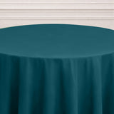 Teal round tablecloth draped elegantly over a table.