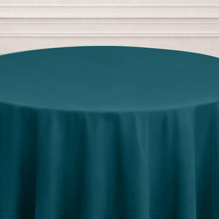 Teal round tablecloth draped elegantly over a table.