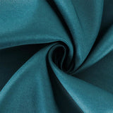 Teal fabric swirl showcasing smooth texture and vibrant color. #whtbkgd