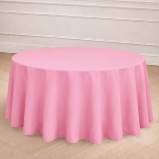 Round pink tablecloth draped elegantly over a table.