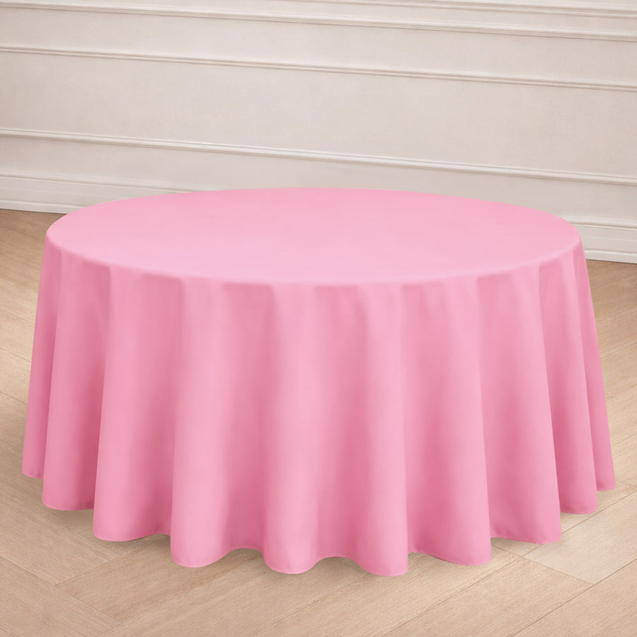 Round pink tablecloth draped elegantly over a table.