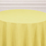 Yellow tablecloth draped elegantly over a round table.