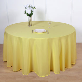 Add Elegance to Your Event with a 120" Yellow Seamless Polyester Round Tablecloth