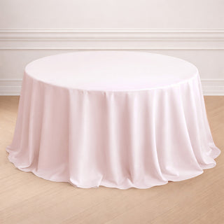 Round pink tablecloth draped elegantly on a table