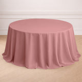 Round pink tablecloth draped elegantly over a table.