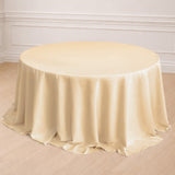 Round ivory tablecloth with elegant draping.