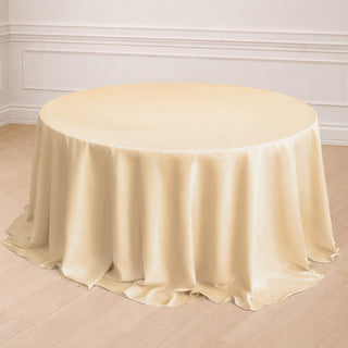Round ivory tablecloth with elegant draping.