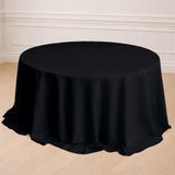 Black round tablecloth draped elegantly over a table.