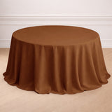 Round brown tablecloth draped elegantly over a table.