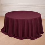 Burgundy round tablecloth draping elegantly over a circular table.