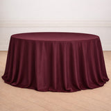 Burgundy round tablecloth draped elegantly over a table