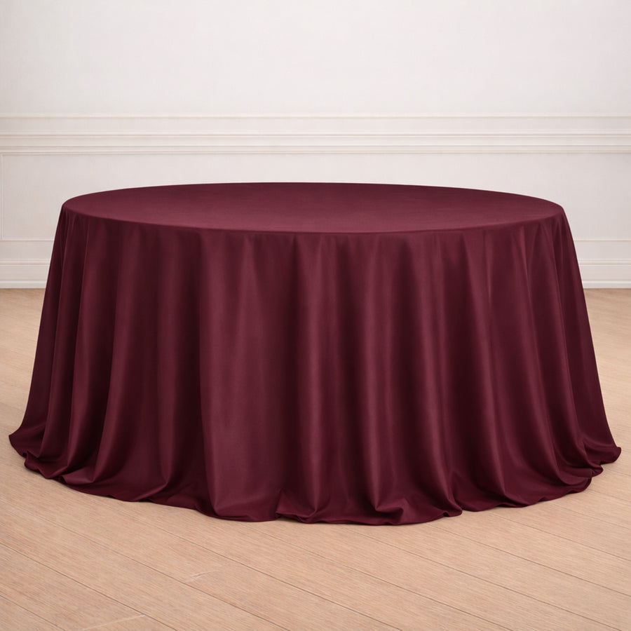 Burgundy round tablecloth draped elegantly over a table