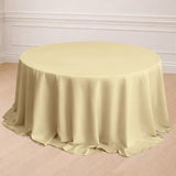 Round yellow tablecloth draped elegantly on a table in a styled setting.