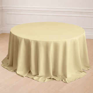 Round yellow tablecloth draped elegantly on a table in a styled setting.
