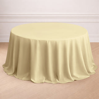 Round beige tablecloth draped elegantly over a round table.