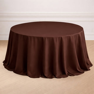 Brown round tablecloth draped over a circular table