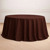 Brown round tablecloth on a wooden floor.