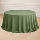 Round olive green tablecloth draped elegantly on a table.