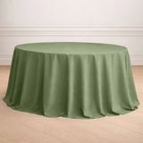 Round green tablecloth draping elegantly over a circular table.