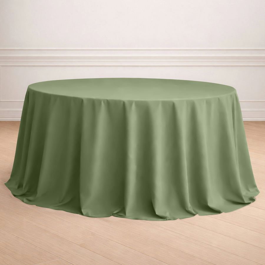 Round green tablecloth draping elegantly over a circular table.