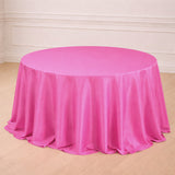 Round pink tablecloth draped elegantly on a table.