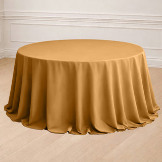 Round gold tablecloth draped elegantly over a table.