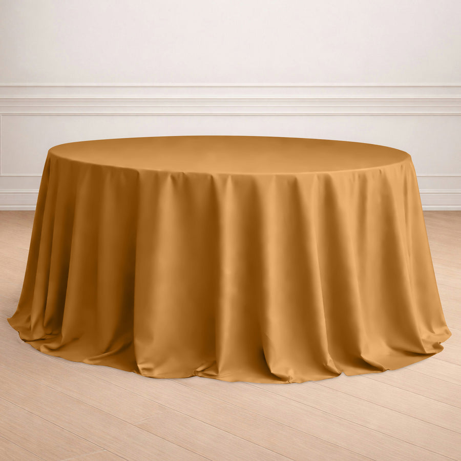 Round mustard tablecloth draped elegantly over a table in a styled setting.