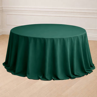 Green round tablecloth draped elegantly over a circular table.